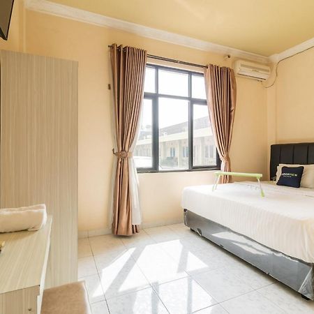 Urbanview Hotel Nugraha Palembang Bagian luar foto